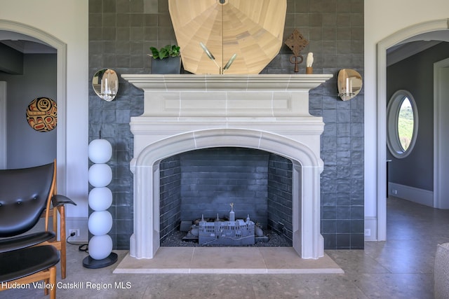 315 Weed Mine Rd, Copake, NY 12521 - detailed view of a fireplace with raised hearth, tile walls, and arched walkways