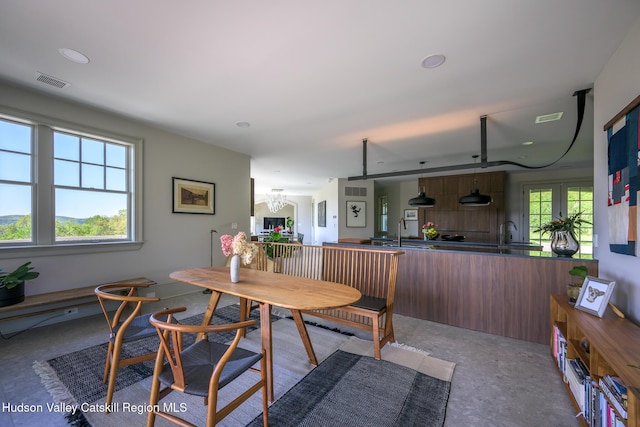 315 Weed Mine Rd, Copake, NY 12521 - dining space with carpet flooring and a chandelier