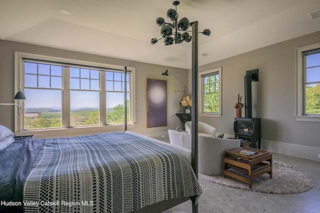 315 Weed Mine Rd, Copake, NY 12521 - bedroom featuring a wood stove and baseboards