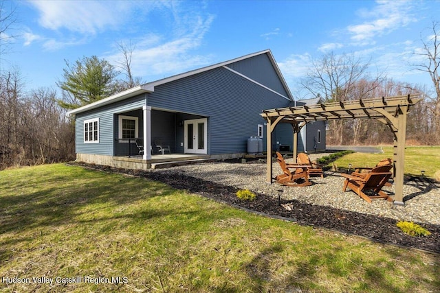 26 Debbie Dr, Athens, NY 12015 - back of property with a pergola, a yard, french doors, and an outdoor fire pit