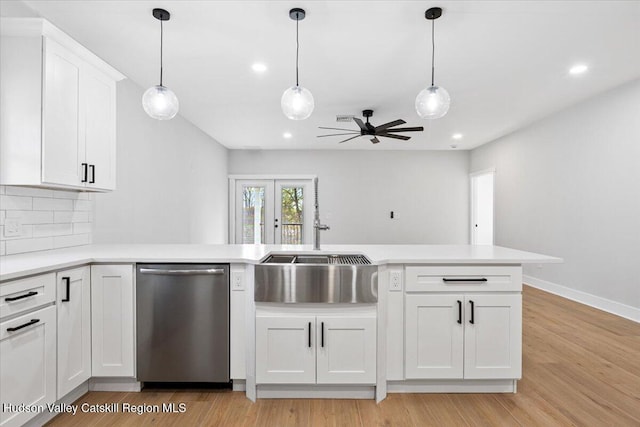 26 Debbie Dr, Athens, NY 12015 - kitchen featuring tasteful backsplash, dishwasher, light countertops, a ceiling fan, and white cabinetry