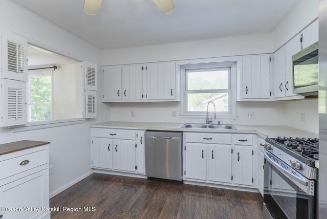 94 Tammany St, Kingston, NY 12401 - kitchen featuring appliances with stainless steel finishes, a sink, and white cabinets