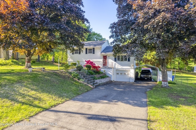 94 Tammany St, Kingston, NY 12401 - tri-level home with asphalt driveway, a front lawn, and a carport
