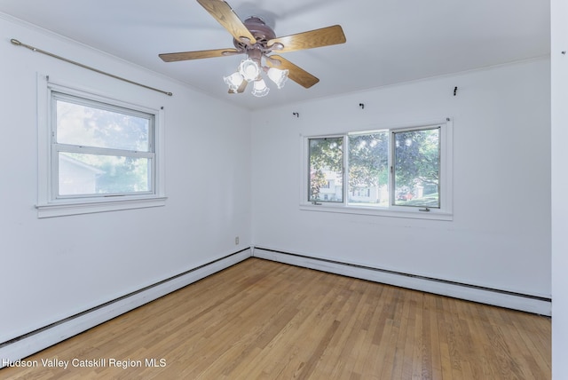 94 Tammany St, Kingston, NY 12401 - empty room featuring a baseboard heating unit, light wood-style floors, and a ceiling fan
