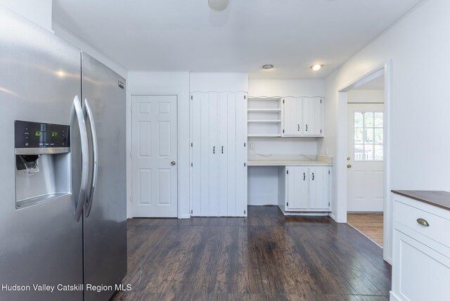 94 Tammany St, Kingston, NY 12401 - kitchen featuring stainless steel fridge, open shelves, dark wood-style flooring, white cabinets, and light countertops