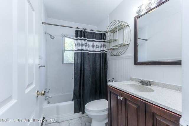 94 Tammany St, Kingston, NY 12401 - bathroom featuring marble finish flooring, shower / bath combo, wainscoting, vanity, and toilet
