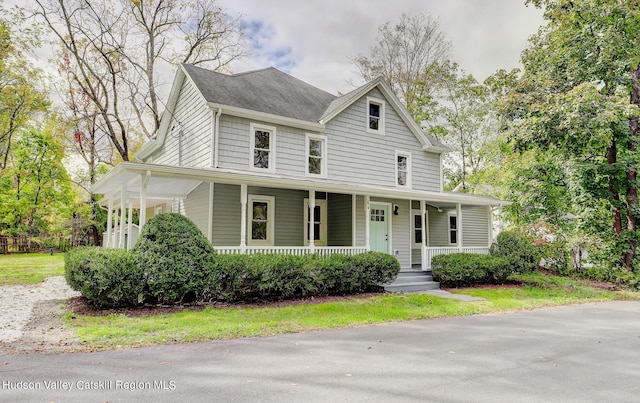 country-style home with a porch