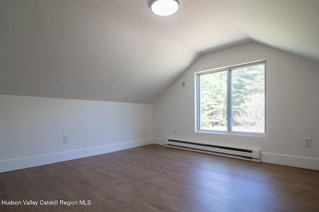 bonus room featuring baseboards, a baseboard radiator, wood finished floors, and lofted ceiling