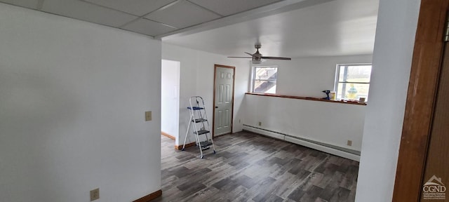 14 Montross St, Saugerties, NY 12477 - unfurnished room with a baseboard heating unit, dark wood-style flooring, baseboards, and ceiling fan