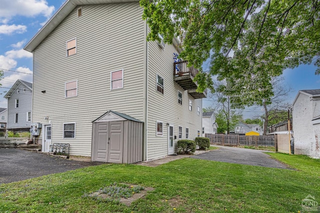 14 Montross St, Saugerties, NY 12477 - rear view of property featuring driveway, a balcony, and a patio area