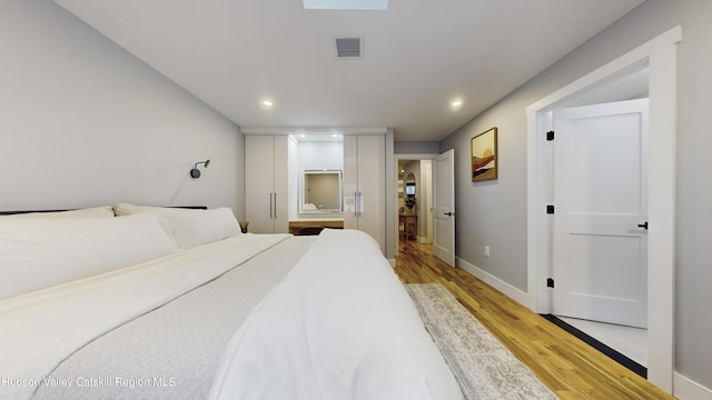 bedroom featuring light wood-type flooring