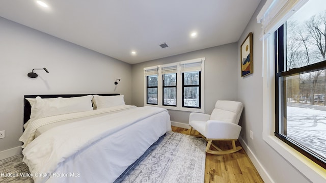 bedroom with light hardwood / wood-style floors