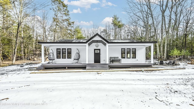 view of front of property with a wooden deck