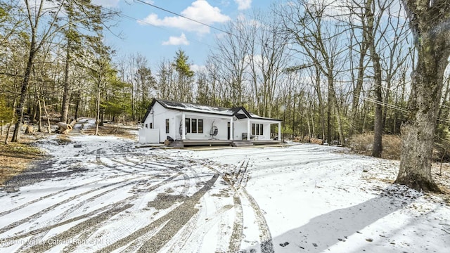 view of front of property with a wooden deck