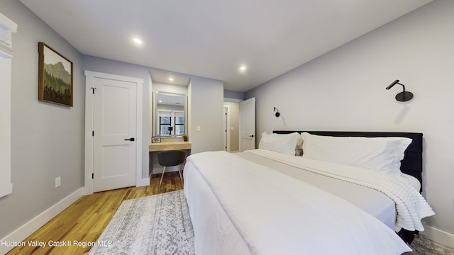 bedroom with light hardwood / wood-style floors