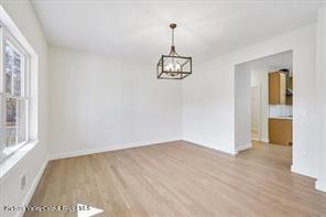 LOT13 Silo Ridge Dr, Wallkill, NY 12589 - unfurnished room with wood finished floors, a chandelier, and baseboards