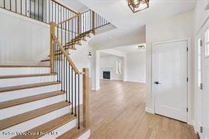LOT13 Silo Ridge Dr, Wallkill, NY 12589 - entryway featuring wood finished floors, stairway, and a fireplace