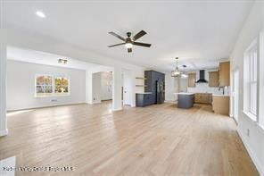 LOT13 Silo Ridge Dr, Wallkill, NY 12589 - unfurnished living room featuring light wood-style floors, a ceiling fan, baseboards, and a chandelier