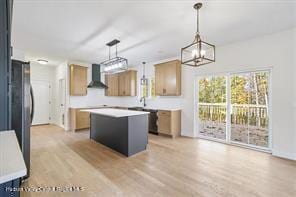 LOT13 Silo Ridge Dr, Wallkill, NY 12589 - kitchen featuring wall chimney range hood, a kitchen island, a chandelier, and light wood-style floors