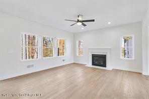 LOT13 Silo Ridge Dr, Wallkill, NY 12589 - unfurnished living room with a ceiling fan, wood finished floors, a fireplace, baseboards, and recessed lighting