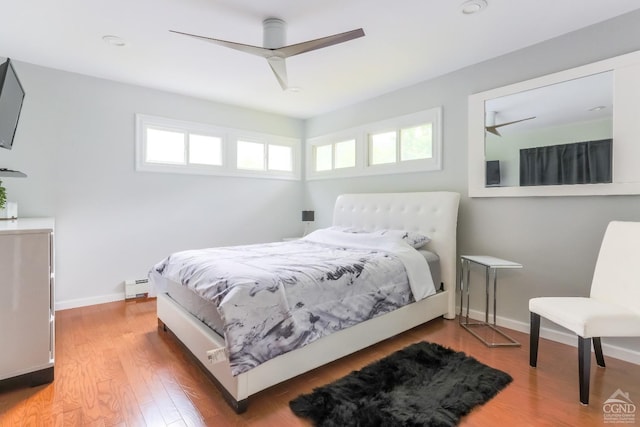12658 Rte 23, Ashland, NY 12407 - bedroom featuring baseboard heating, wood finished floors, baseboards, ceiling fan, and recessed lighting