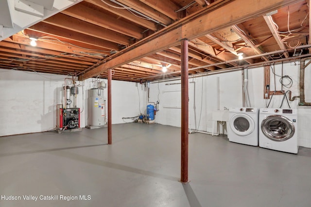 512 Watson Woods Rd, Lake Hill, NY 12448 - unfinished basement with water heater, washing machine and clothes dryer, a heating unit, and a water pressure tank