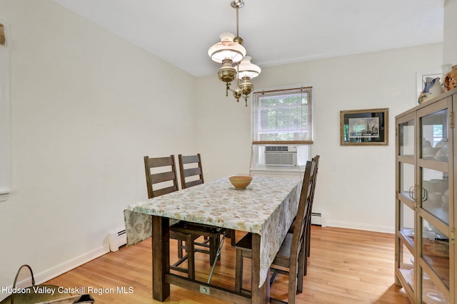 512 Watson Woods Rd, Lake Hill, NY 12448 - dining area featuring cooling unit, light wood finished floors, a baseboard radiator, and baseboards