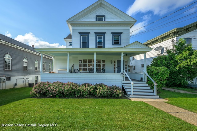 66 Green, Hudson, NY 12534 - view of front of home featuring a porch and a front lawn