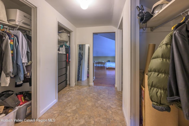 66 Green, Hudson, NY 12534 - walk in closet featuring vaulted ceiling