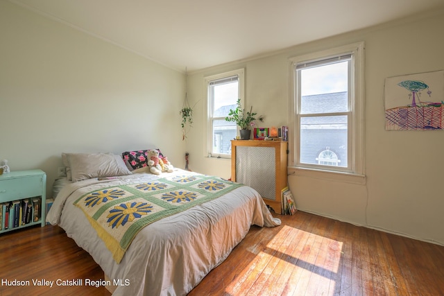 66 Green, Hudson, NY 12534 - bedroom with crown molding and wood-type flooring