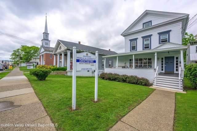 66 Green, Hudson, NY 12534 - greek revival inspired property with a front lawn and covered porch