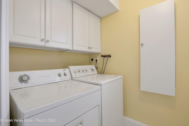 laundry room with cabinet space and separate washer and dryer
