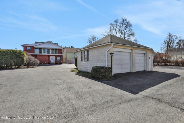 exterior space featuring a detached garage