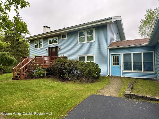 212 S St, Windham, NY 12496 - back of property featuring a lawn, a deck, and a chimney
