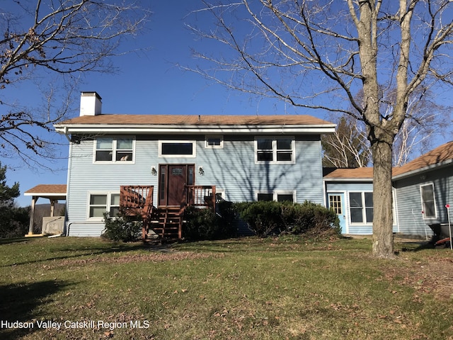 212 S St, Windham, NY 12496 - rear view of property featuring a chimney and a lawn