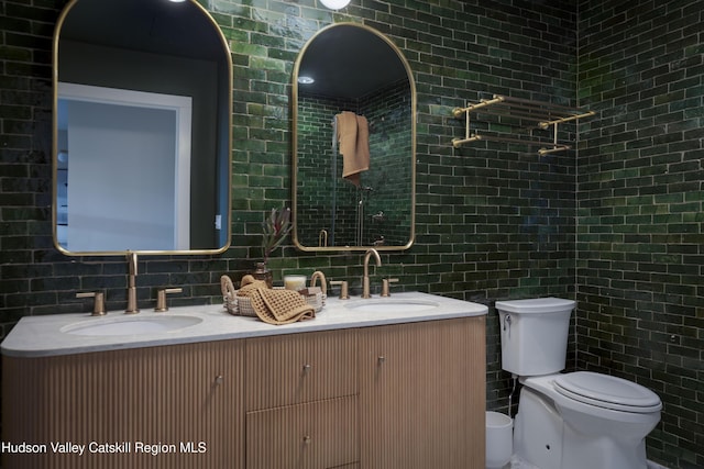 bathroom with decorative backsplash, tile walls, toilet, and vanity