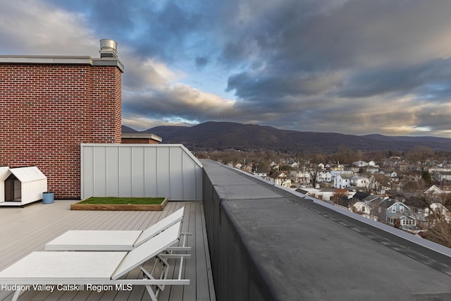 balcony featuring a mountain view