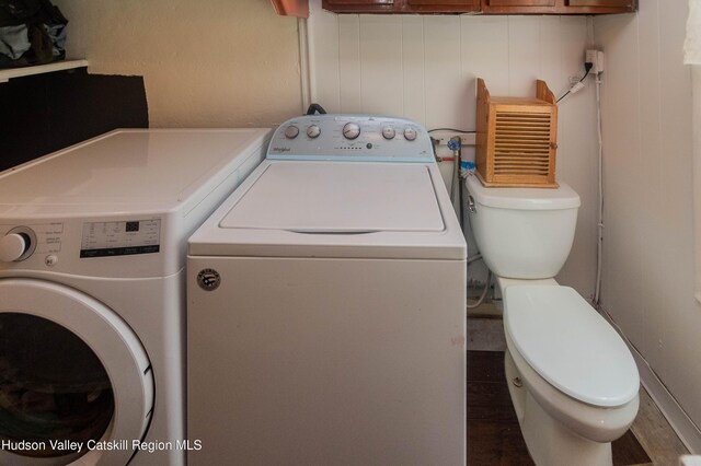 73 Cauterskill Ave, Catskill, NY 12414 - laundry room featuring washing machine and clothes dryer and wood finished floors