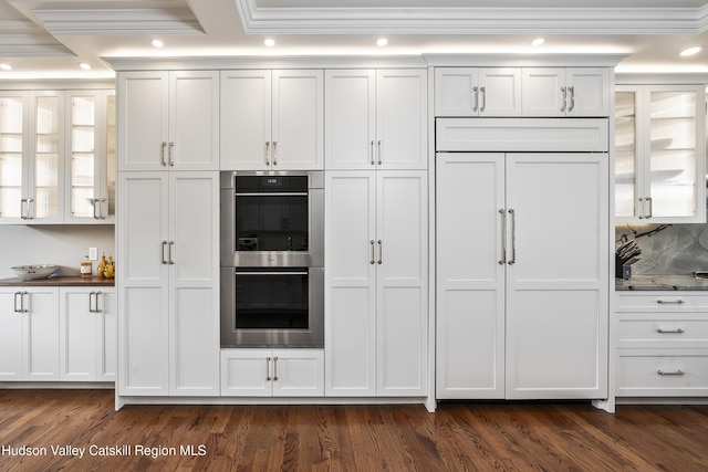 1 Stoneridge Dr, Loudonville, NY 12211 - kitchen featuring stainless steel double oven, crown molding, dark wood-type flooring, white cabinetry, and glass insert cabinets