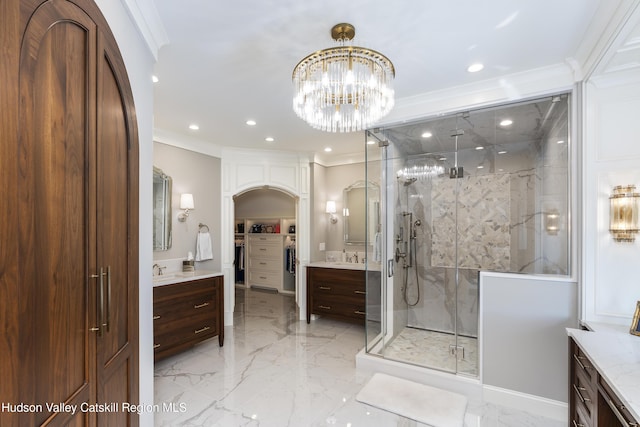1 Stoneridge Dr, Loudonville, NY 12211 - full bath with marble tiled flooring, a marble finish shower, crown molding, two vanities, and recessed lighting