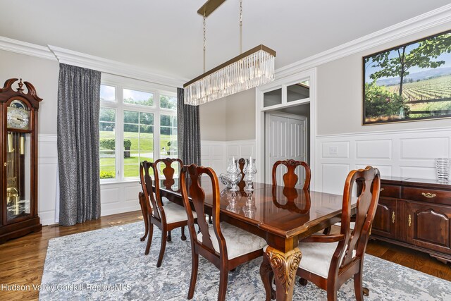 1 Stoneridge Dr, Loudonville, NY 12211 - dining space featuring a decorative wall, ornamental molding, a chandelier, wood finished floors, and wainscoting