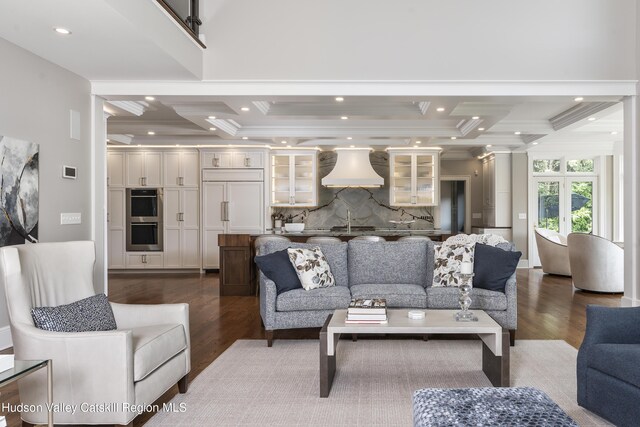 1 Stoneridge Dr, Loudonville, NY 12211 - living area featuring coffered ceiling, dark wood-type flooring, ornamental molding, recessed lighting, and decorative columns