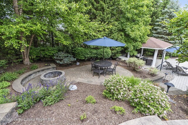 1 Stoneridge Dr, Loudonville, NY 12211 - view of patio featuring a fire pit, a gazebo, and outdoor dining area