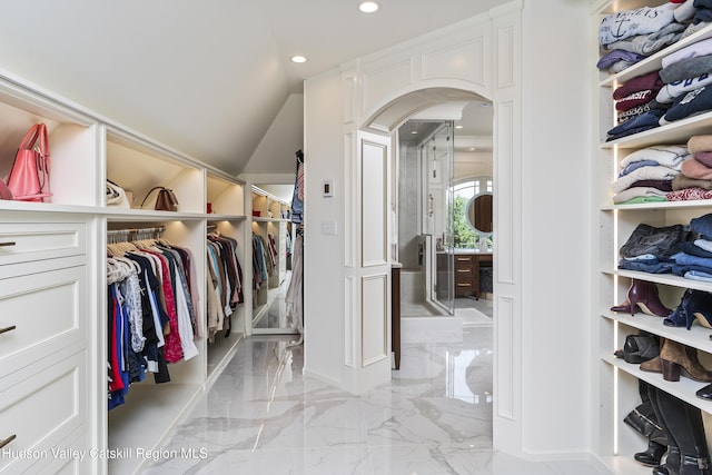 1 Stoneridge Dr, Loudonville, NY 12211 - spacious closet featuring light marble finish floors, arched walkways, and lofted ceiling