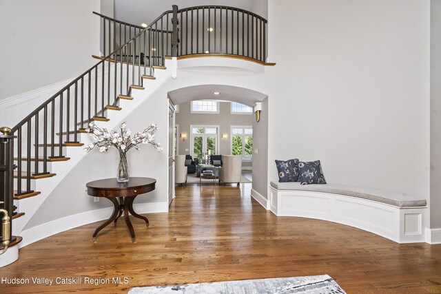 1 Stoneridge Dr, Loudonville, NY 12211 - foyer with a towering ceiling, wood finished floors, stairway, and arched walkways
