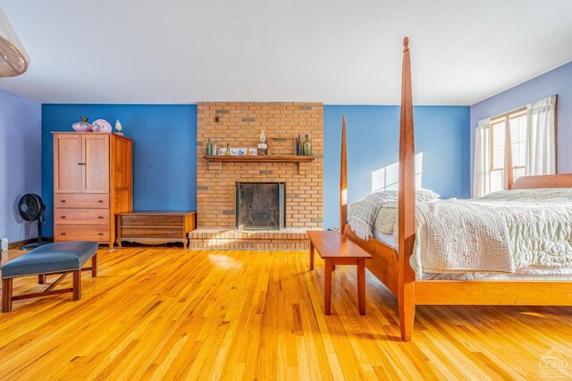 176 High Rock Rd, West Coxsackie, NY 12192 - bedroom with light wood finished floors and a fireplace