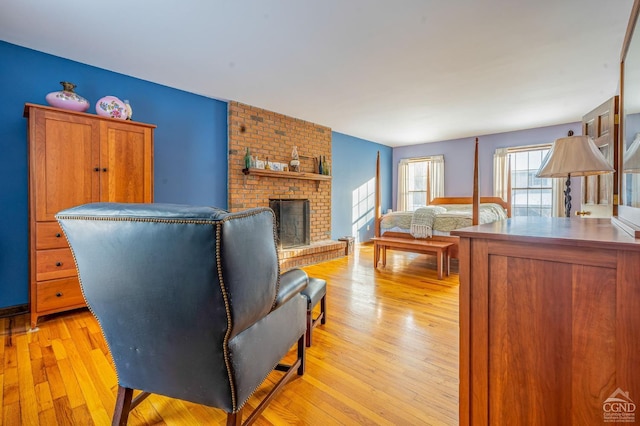176 High Rock Rd, West Coxsackie, NY 12192 - living area featuring light wood-type flooring and a brick fireplace