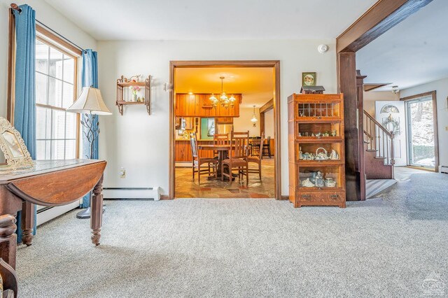 176 High Rock Rd, West Coxsackie, NY 12192 - living area with carpet floors, a chandelier, stairs, and a baseboard heating unit