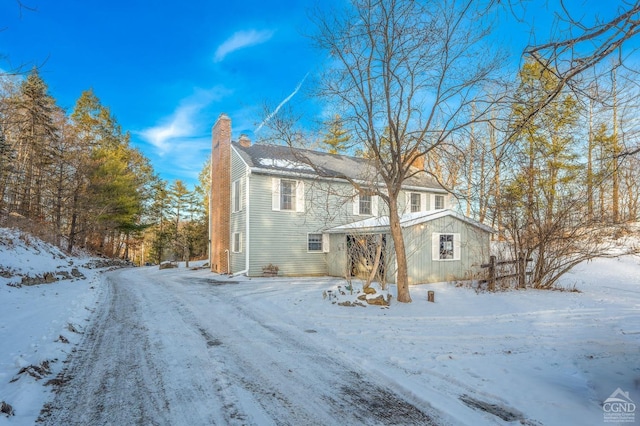 176 High Rock Rd, West Coxsackie, NY 12192 - view of snow covered exterior featuring a chimney