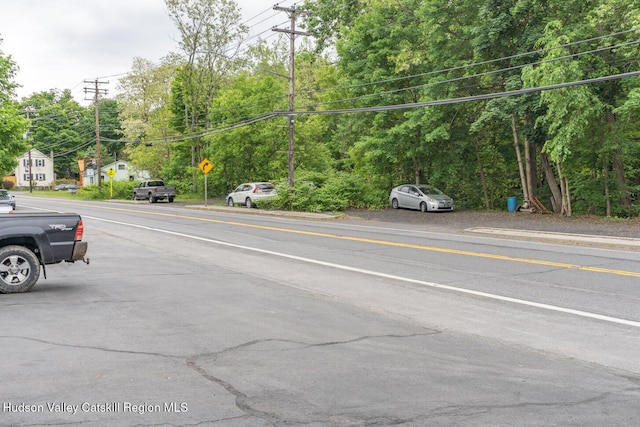 753 Rte 217, Hudson, NY 12534 - view of asphalt road featuring traffic signs and view of wooded area